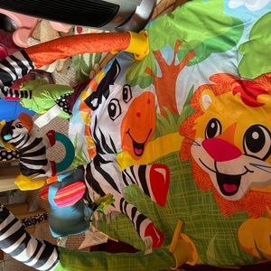 INFANTINO INFANT PLAY GYM. Zebra, lion, elephant, and hippo. Item sold as is.